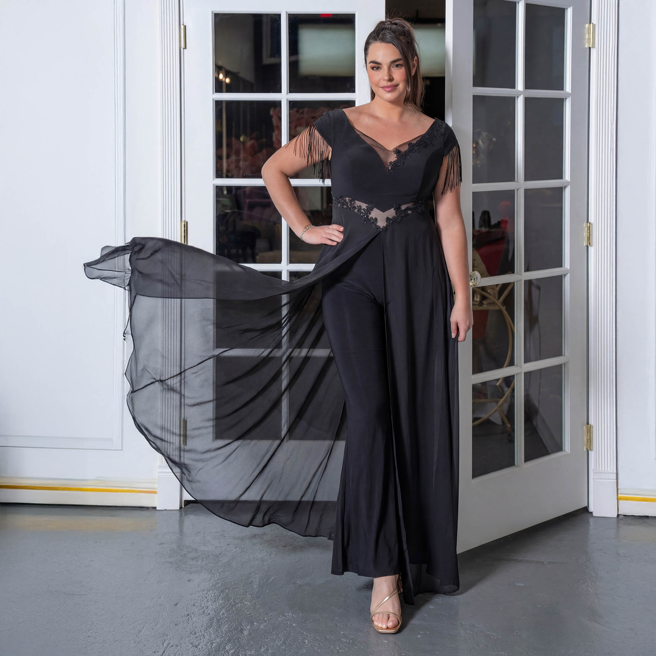 an elegant evening jumpsuit for mother of the bride with fringe sleeve like element