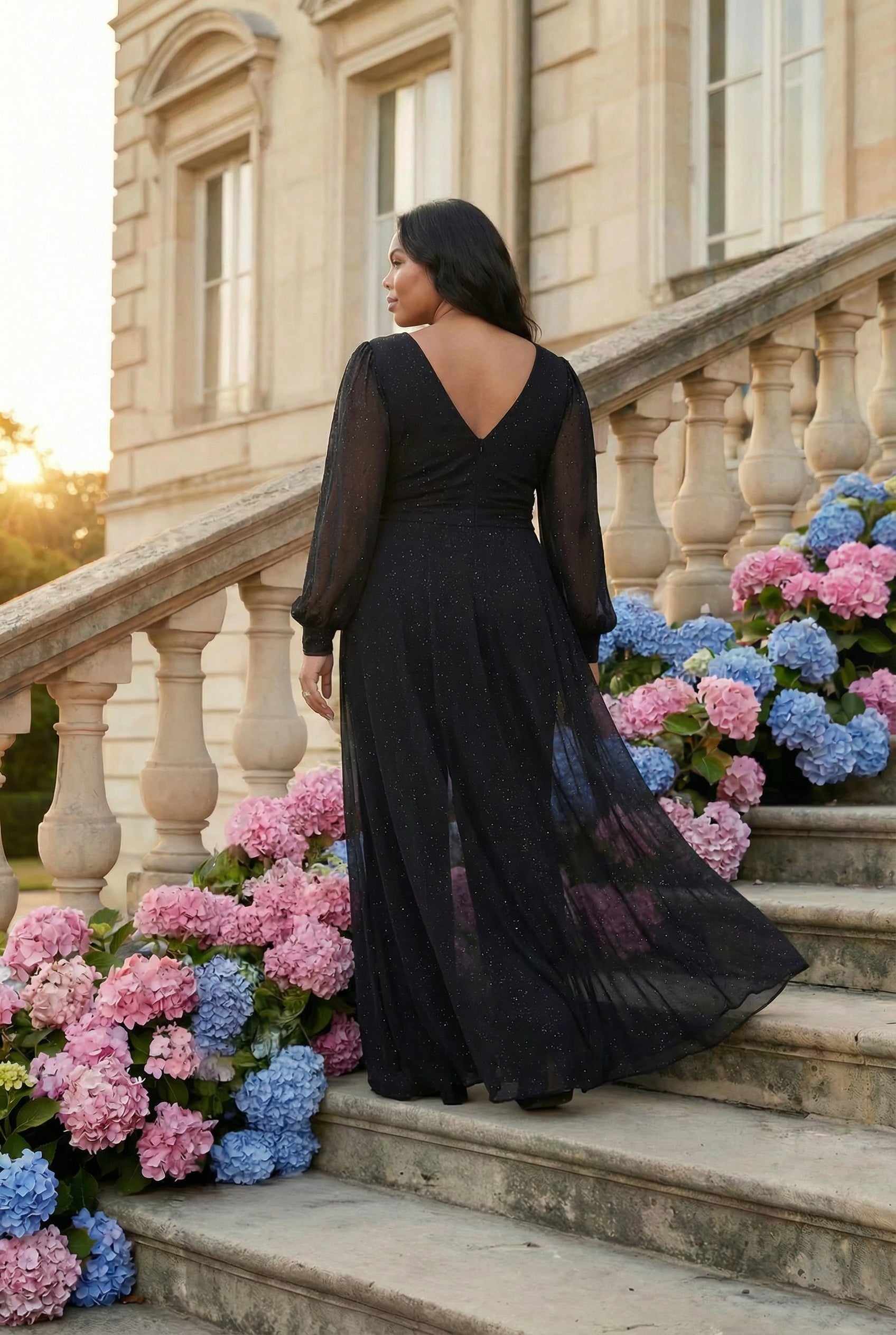 back view of a black sparkly jumpsuit